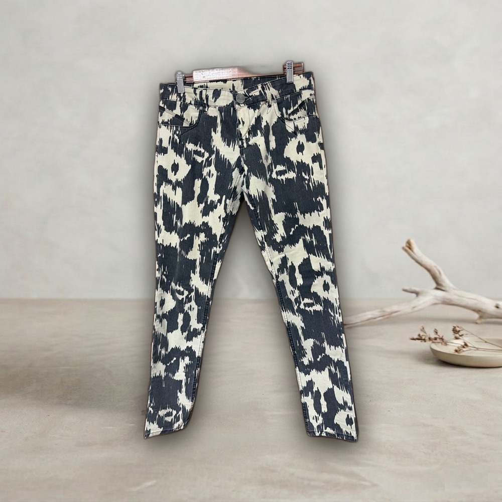 Jean chupin estampado vaca beige/negro tiro bajo 